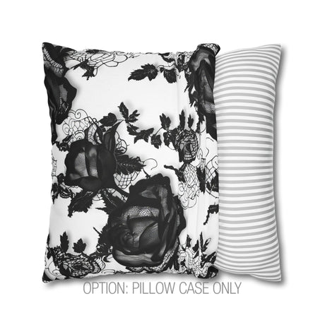 a black and white pillow with a flower on it